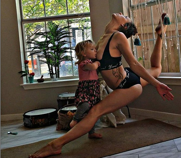 Amazing Mom Does Yoga While Breastfeeding Her Two-Year Old Daughter